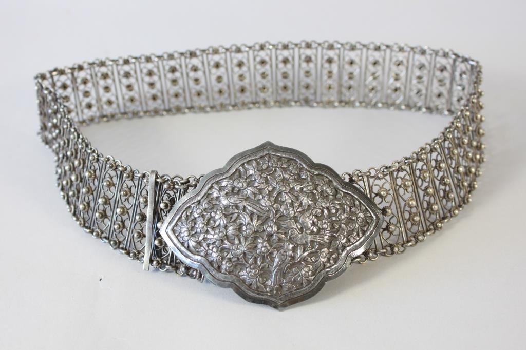 MIDDLE EASTERN SILVER BELT W/ ENGRAVED BUCKLE: Dimension: L 32" (open) Buckle: 3.25" wide Condition: Very good.