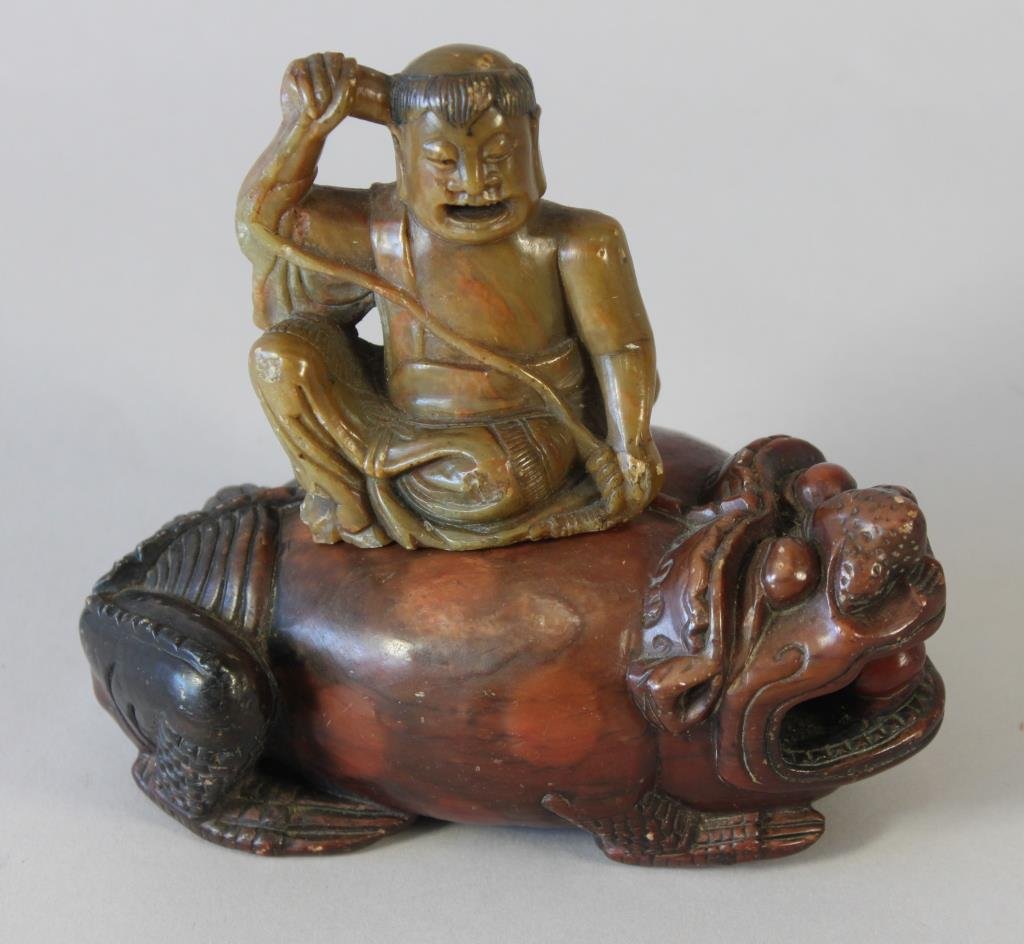 ANTIQUE CHINESE SOAPSTONE INCENSE BURNER: In the form of man riding a jin chan Dimension: L 5 1/2" x W 3" x H 5" Condition: light chipping