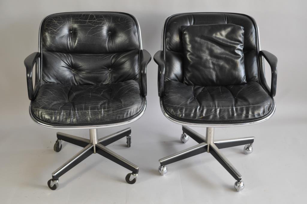 PAIR OF CHARLES POLLOCK FOR KNOLL OFFICE CHAIRS: Leather seated, different wheels on one chair Dimensions: L 27" x W 26 1/2" x H 34" Condition: wear to leather on both chairs, tear to one seat Provenance: From a Redding, CT Estate.
