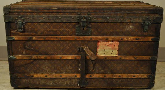 LOUIS VUITTON STEAMER TRUNK: Dimensions: L 39 1/2" x W 22" x H 23" Condition: as is, loss and very musty, most definitely needs restoration. Provenance: From the estate of Paul Heifetz, son of Yasha Heifetz