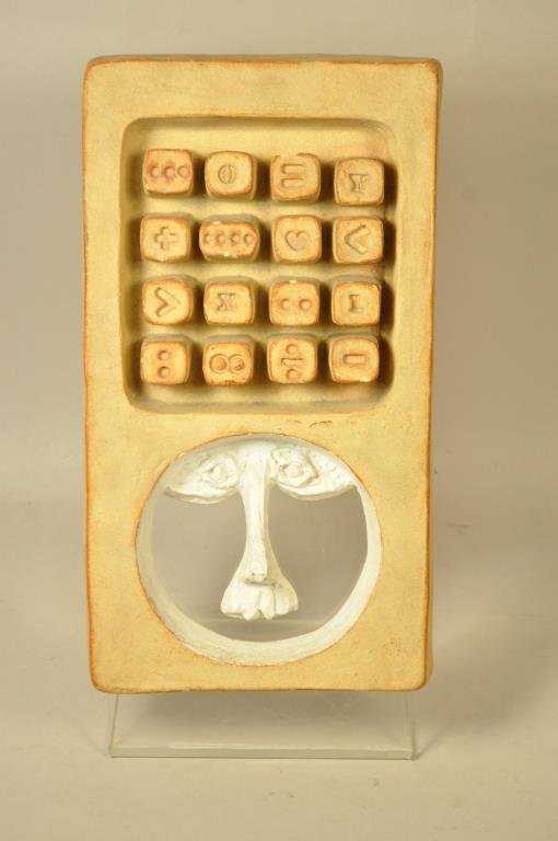 BENNINGTON POTTERY DAVID GIL FACE SCULPTURE: Signed on back Bennington Potters 1987. Dimension: 7 1/2" X 16" Condition: Small chip to a few of the numbers.