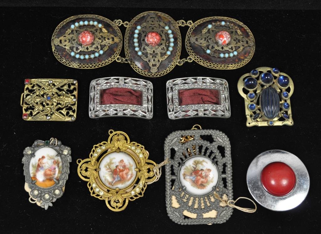 ANTIQUE BUCKLE/JEWELRY FINDING GROUPING: All in as found condition. Largest is faux tortoise shell and glass, painted cameos, rhinestone shoe clips, celluloid buckle etc. Largest buckle: 6" X 2" Provenance: From the Estate Antique collection