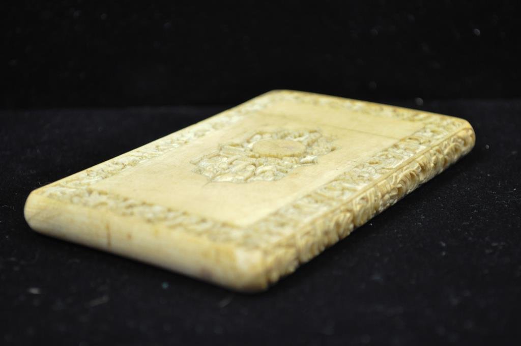 CARVED IVORD CARD CASE 2: Dimensions: L 4 1/2" x W 2 1/2" x H 1/4" Condition: overall good condition, some hairlining to back bottom, to be expected from age Provenance: From the Estate Antique collection of Arthur + Joe Robin