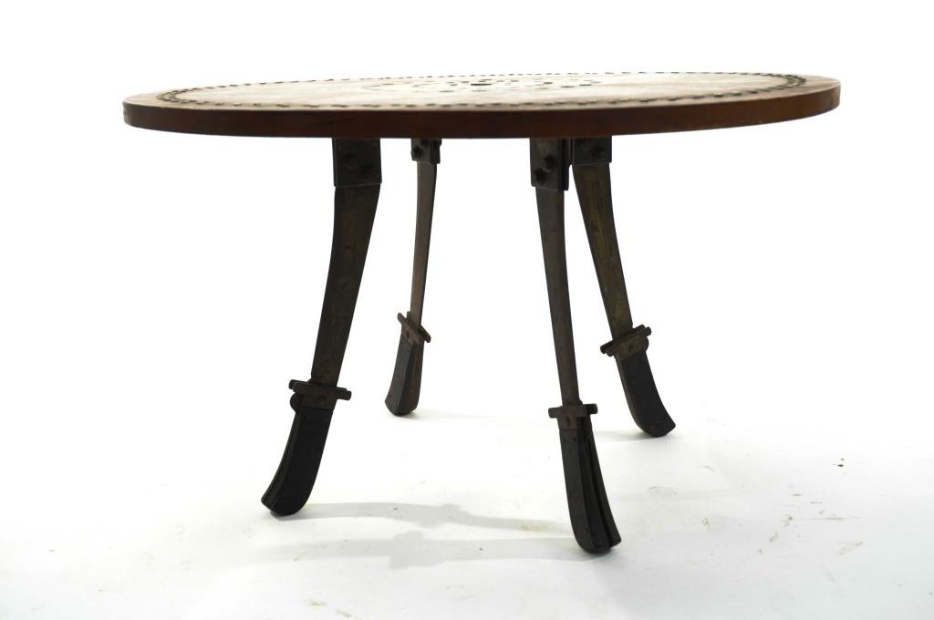 MACHETE AND BULLET COFFEE TABLE: Dimensions: Diameter 28 1/2" x H 17" Condition: overall good condition, some wear to base