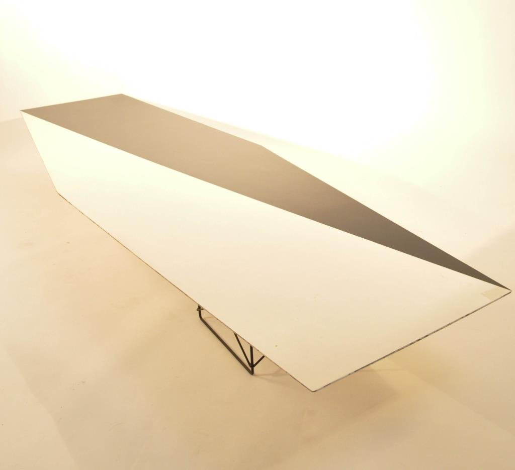 EAMES ERA SURFBOARD COCKTAIL TABLE: Most likely for Herman Miller With laminate top and wire base Dimensions: L 90" x W 29" x H 10" Condition: Bump to a corner causing a tear to laminate edge, scuffing to edges