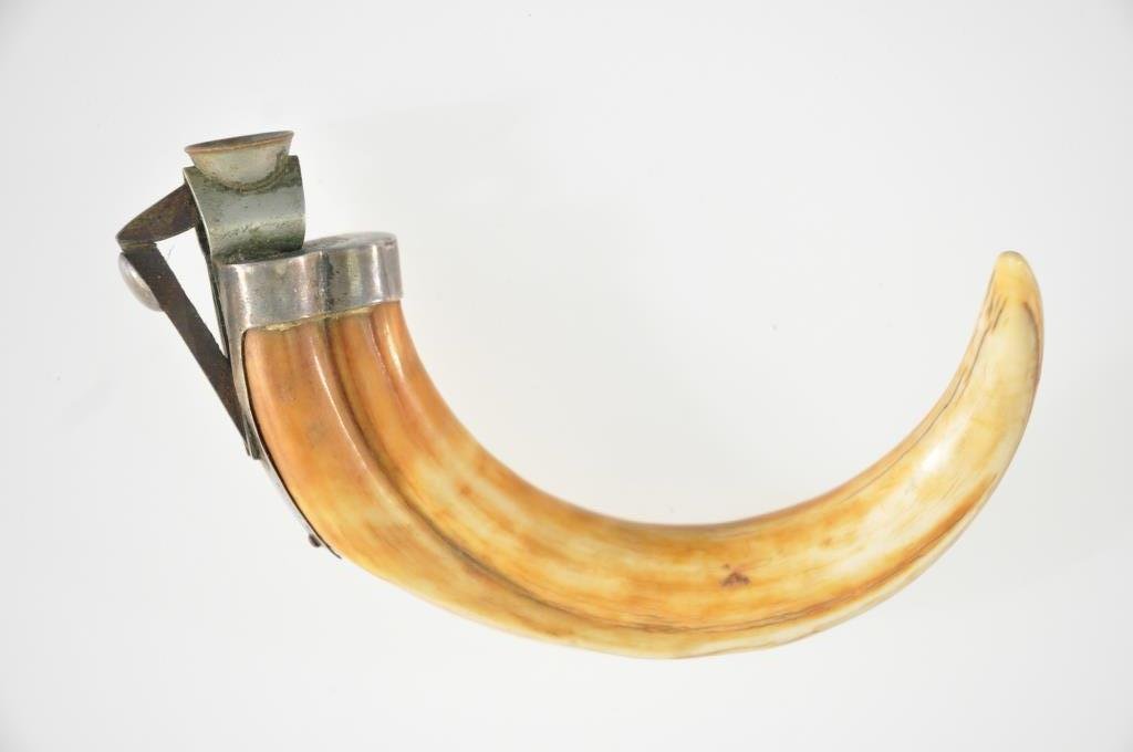 ANTIQUE MOUNTED TUSK CIGAR CUTTER: With Sterling mount. Dimension: 5" X 4" Condition: good, some crackling lines through bone