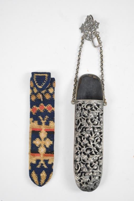 TWO 19TH CENTURY EYEGLASS HOLDER CASES: 1. 19th Century fancy silver plate eyeglass case with chain holder. Dimensions: H 10". Condition: good 2.19th Century fancy colorful embroidery eyeglass case. Dimensions: H6 1/2" Condition: good