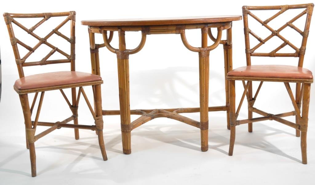 FAUX BAMBOO CONSOLE & CHAIRS: Two bamboo chairs and a demilune console table Dimensions (chairs): H 32 1/2" x W 16 1/2" x D 17" Dimensions (table): H 30" x W 40 1/4" x D 20" Condition: one chair has burn hole to vinyl, both chairs