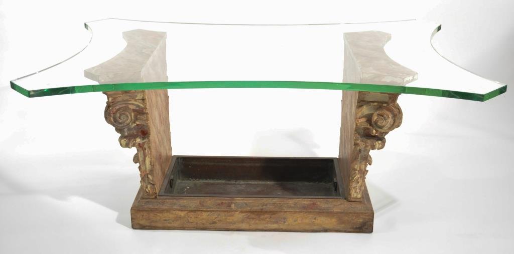 1940S GLASS TOP COFFEE TABLE: On a faux-painted Corinthian style base with copper inserts Dimensions: H 20 1/2" x W 48" x D 32" Condition: 1/4" scallop chip to glass corner, repair to base support, some losses to paint