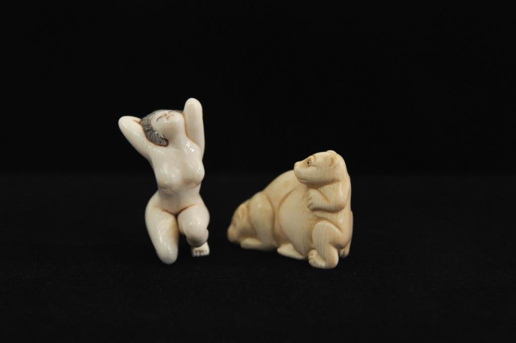 GROUPING OF 2 IVORY NETSUKE: Grouping including bears and Nude woman Dimension: Woman: H 1 3/4" Bear: W 1 3/4" Condition: Good.