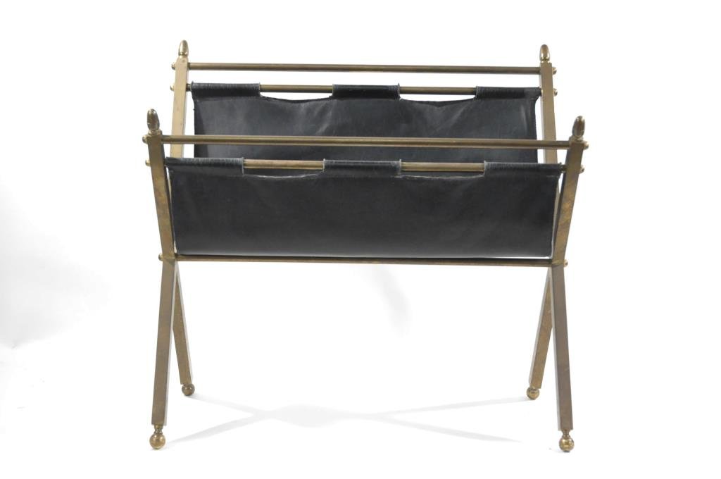 SOLID BRONZE AND LEATHER MAGAZINE RACK: Unmarked, possibly French, in the style of Jacques Adnet. Rack is of solid bronze and a fine black leather with finials to the supports. Dimensions: H 18" x W 20 1/2" x D 10" Condition: good, some wea