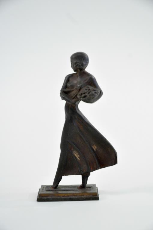 MARIO KORBEL (CZECH / AMERICAN 1882 -1954) BRONZE: Untitled (woman carrying grapes) Bronze ,signed lower tip to the toe of the base, MARIO KORBEL Dimensions: H 4 3/4" X W2 3/4" X D 1 1/8" Condition: Good, gold wash patina has worn off and has two gree
