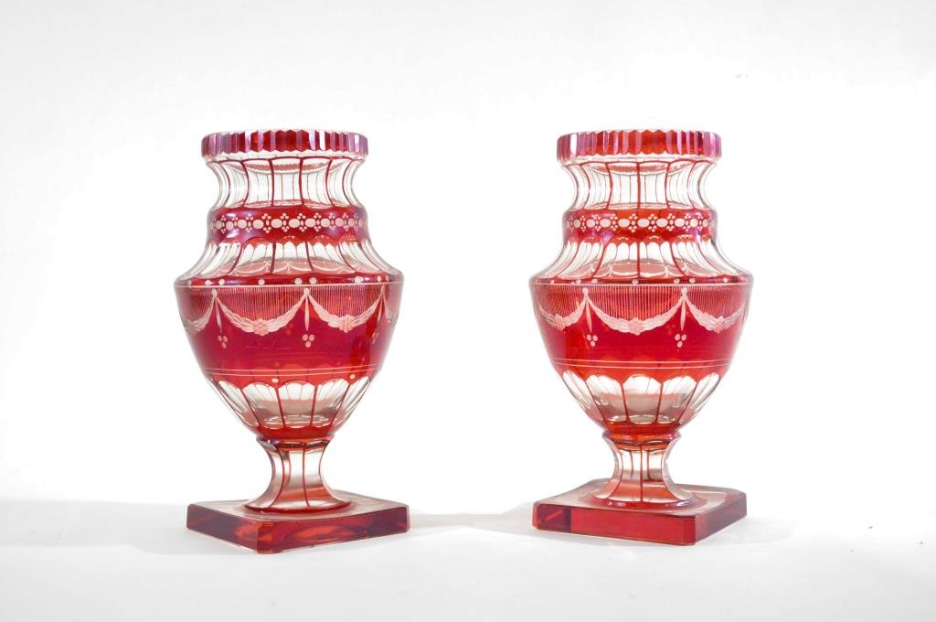 PAIR OF CUT TO CLEAR 19TH CENTURY GLASS VASES: Urn shaped, probably English, ca 19th century, with swags on sides. Dimensions: H 9" x Diameter 6" Condition: some fleabites to base