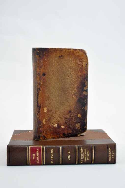 1837 EDGAR ALLEN POE'S SIGNED COPY OF THE ALHAMBRA: Possible Edgar Allen Poe forgery by Joseph Cosey. Signed copy of "The Alhambra", signed "Edgar A. Poe Dec 25th 1837" on second page. Comes in custom leather case. The Alhambra was Poe's inspiration to