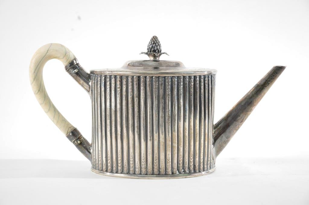 19TH C. STERLING SILVER TEA POT BY CHARLES BOYTON: 1830's-1840's by Charles Boyton London. Bone handle, reeded canister body with long tapering spout, pineapple finial Dimensions: H 5 1/2" X W 11" X D 4" Total Weight: 18.85ozt (including handle) Condi