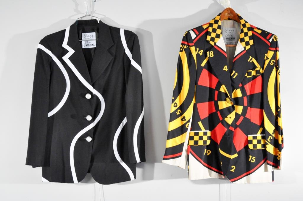 TWO MOSCHINO BLAZERS: BLACK WITH WHITE ACCENT BULLS EYE PRINT/DART BOARD Note: All clothing is from the same estate and mostly in very good condition. All clothing sold as is. Please preview the week before the auction or 