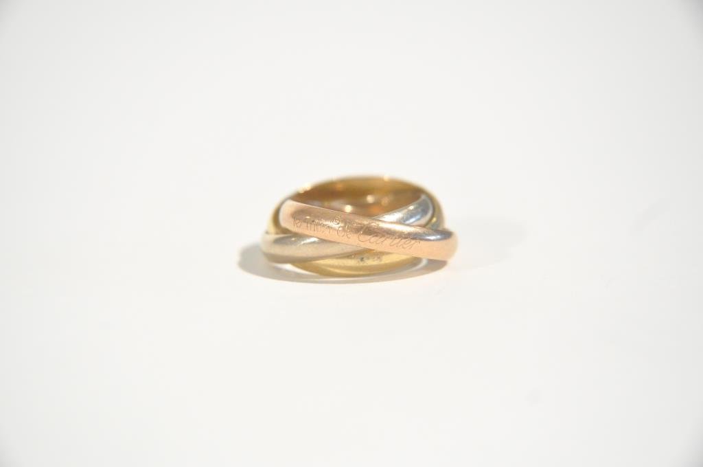 CARTIER 18K GOLD TRINITY RING: Composed of yellow, white and rose gold. Marked 750 Cartier 45.5 Ring Size: 3Total Weight: 2.7dwtCondition: Good, scratches due to use.