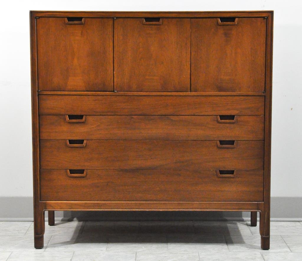 MID-CENTURY JOHN STUART WALNUT DRESSER: Janus collection, marked to inside drawerDimensions: H 46.25" x W 45.75" x D 19"Condition: some losses to veneer around base, splitting to top