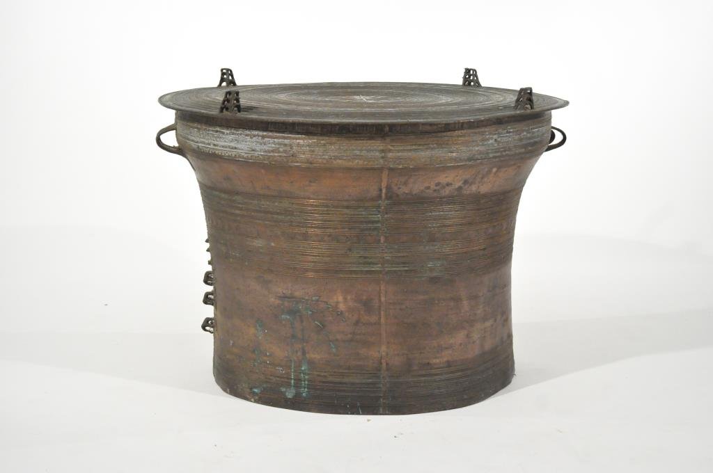 ANTIQUE CHINESE BRONZE DRUM TABLE: Most likely Chinese or Southeast Asian originDimension: H 21" x W 27.5" (top)Condition: Some dents.Provenance: From the descendants of a late 19th C. Siam logging operation