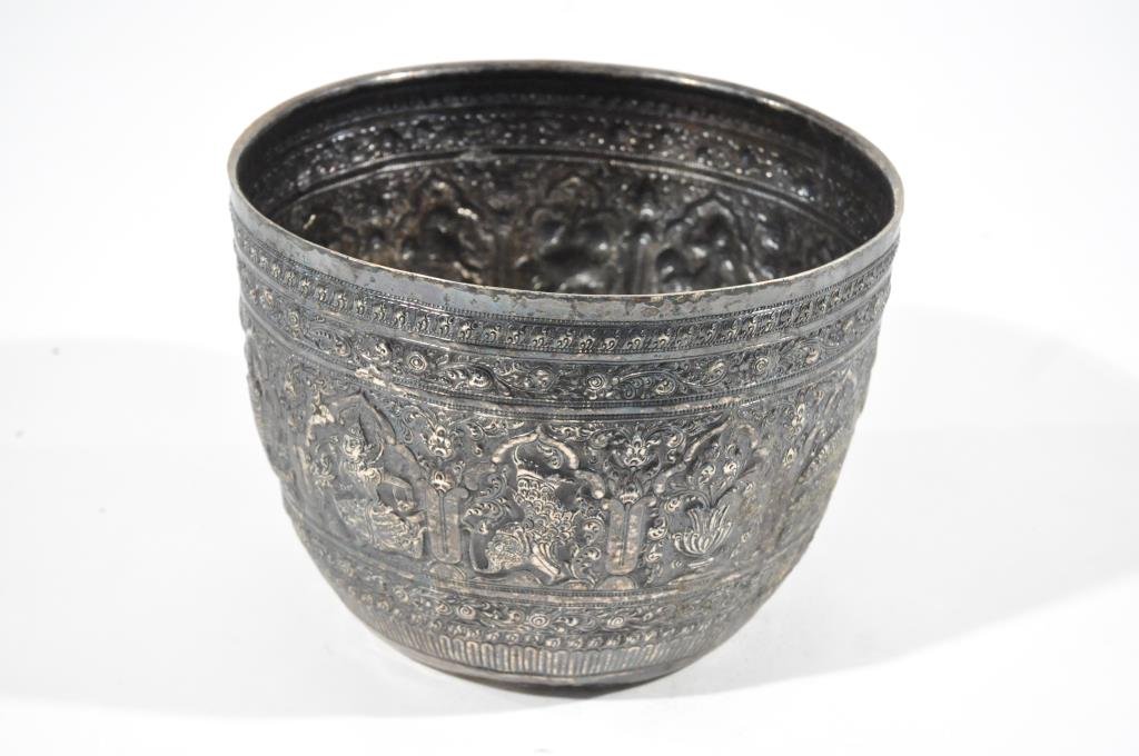 ANTIQUE SIAMESE STERLING SILVER CACHEPOT: Heavy repousse work including images of idols and ocean creatures. Signed on bottom with symbols and lion figure. Dimension: H 7.5" x D 10"Weight: 36.94oztCondition: Overall Good, signs of age. Small 