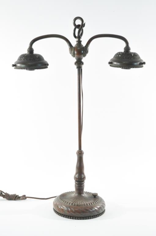 LOUIS COMFORT TIFFANY DOUBLE STUDENT TABLE LAMP: Bronze base, bottom incised "Tiffany Studios New York 28600"Dimensions: H 26" x W 18" x D 7"Condition: good, without shades