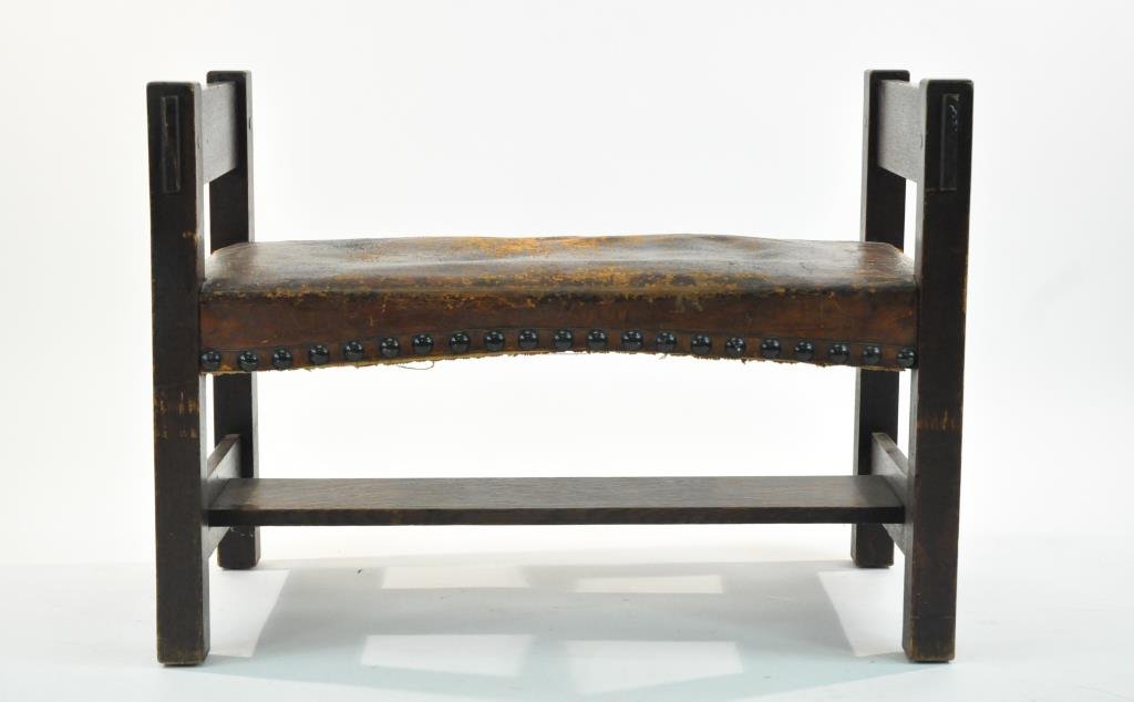 GUSTAV STICKLEY ARTS AND CRAFTS WINDOW SEAT: #178, heavy thrutenon construction with original leather seat and original tacks, lower stretcher supported by horizontal key and tenon construction, original finish, unmarkedDimensions: H 26" x W 36"