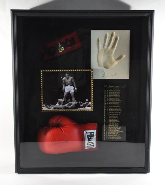 MUHAMMAD ALI SIGNED GLOVES SHADOW BOX: Mixed-media, ______, signed boxing glove, photograph, signed hand print and list of Muhammad Ali's fight statistics. Dimension: Frame: H 32" X W 27" D 7" Condition: good