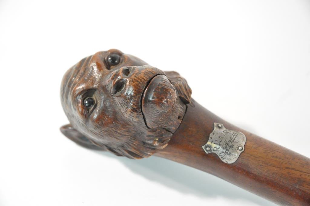 MONKEY WALKING CANE WITH GLOVE HOLDER: Carved wood monkey with glass eyes and opening mouthDimensions: H 36"Condition: good