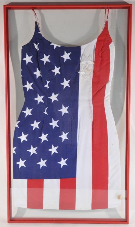 AMERICAN FLAG DRESS: A dress for a converted American flag. Dimensions: Framed H36" x W 21", (sight) H 33" x W 17.5Condition: good