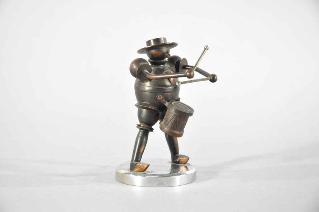 WIENER WERKSTATTE STYLE DRUMMER MAN: Mixed metal including copper. Marked with a cirlced Z to base.Dimensions: H 4.75" X W 2.5"Condition: Good