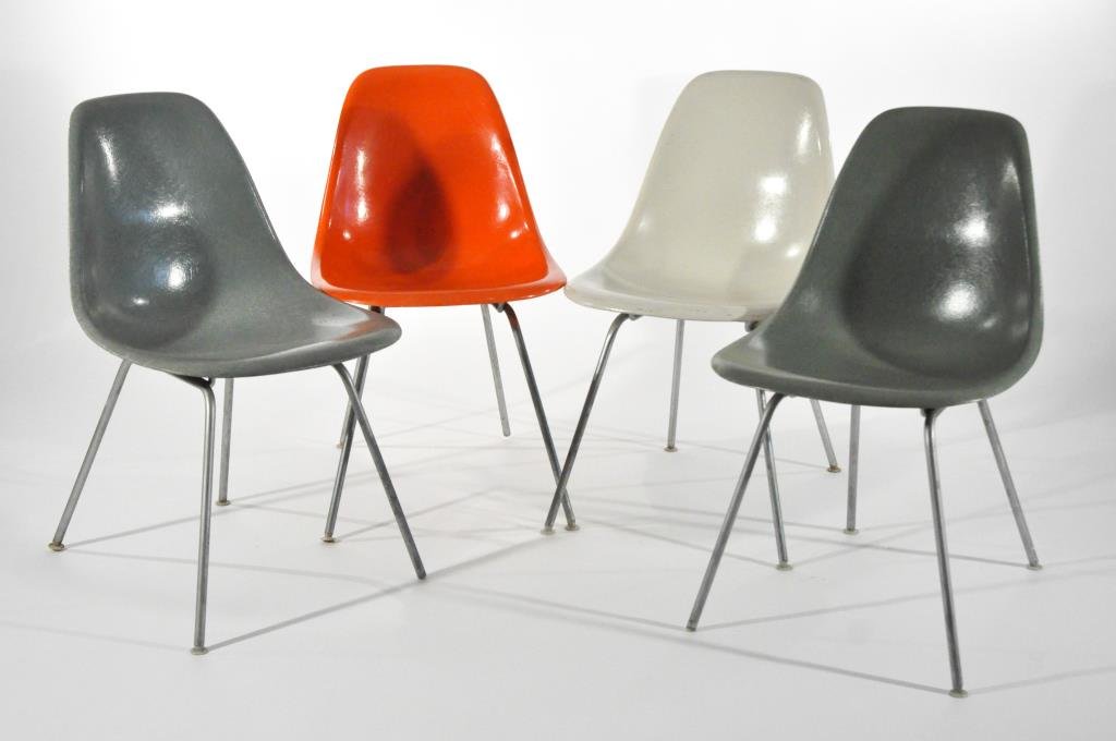 4 CHARLES & RAY EAMES FIBERGLASS SHELL CHAIRS: Dimensions: H 31" X W 18.25" D 22.5"Condition: Good, age appropriate wear and fading.