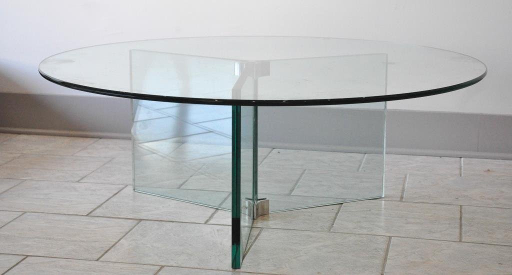 PACE COLLECTION STYLE PLATE GLASS COFFEE TABLE: 3 squared plate glass legs joined at top and bottom by chromed fasteners, supporting a rounded glass top.Dimension: H 15.75" x Diameter 42" Condition: Good
