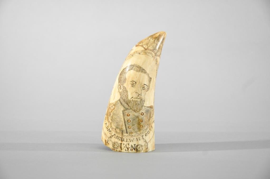 US NAVAL PORTRAIT SCRIMSHAW WHALE TOOTH: 19th Century, American.Finely carved portrait of US Navy Admiral Andrew H. Foote on front with a double anchor, hearts and stars. On reverse is a bald eagle seated atop of the earth with 1862 above. R