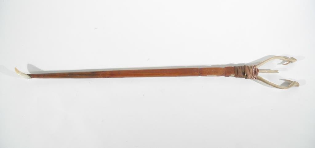 NATIVE AMERICAN FISHING SPEAR: Made from bone, wood and teeth.Dimensions: L 32.5" X W 4"Condition: Good