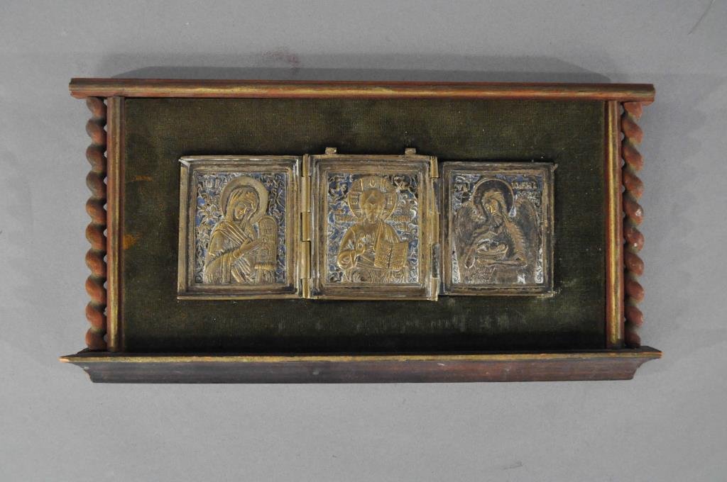 19TH CENTURY RUSSIAN TRYPTICH ICON: Depicting L to R Mother Mary, Christ and John the Baptist Brass and enamel, mounted on a green velvet an wood panelDimensions: Framed: H 6.25" X W 12"Condition: Good, missing enamel.