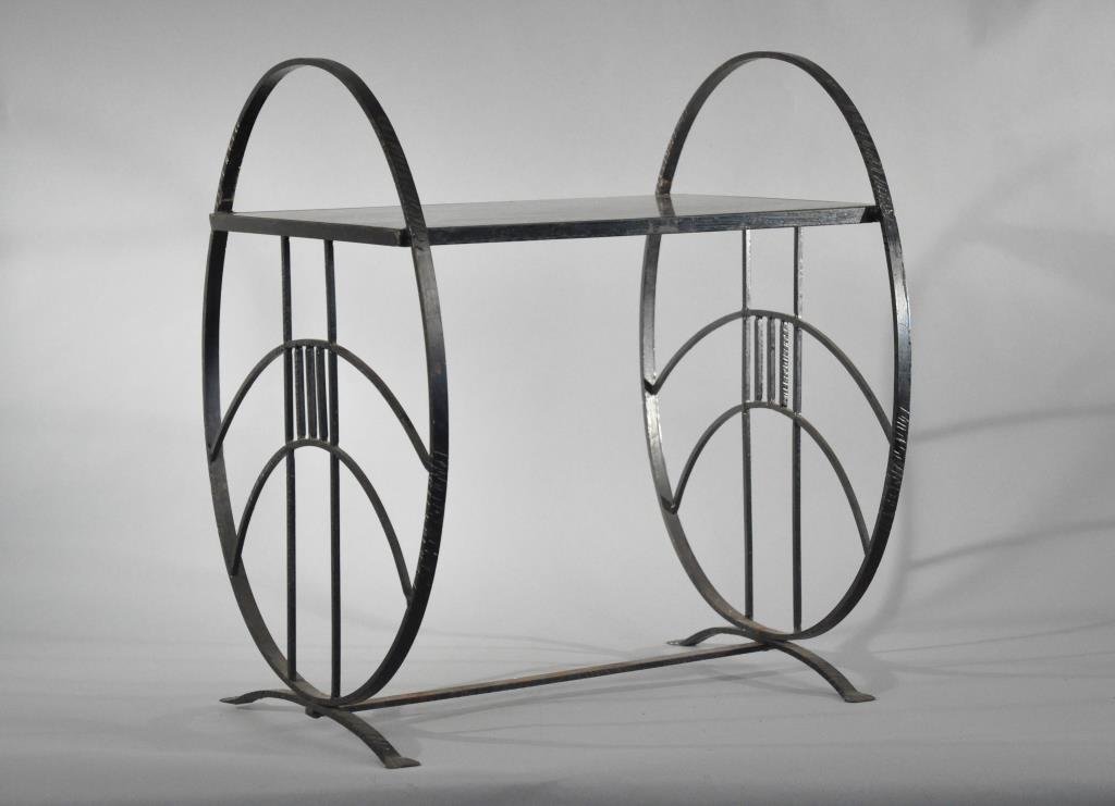 FRENCH ART DECO WROUGHT IRON & GLASS TEA TABLE: With black glass top.Dimensions: H 24.5" X W 21.5" X D 17"Condition: Good, scratches to glass.