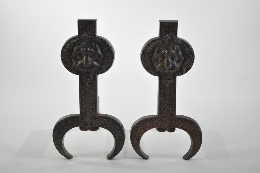 AESTHETIC MOVEMENT LIONS FACE ANDIRONS: Of iron, good design.Dimensions: H 21" X W 10.75" X D 19"Conditions: Good, light rust.