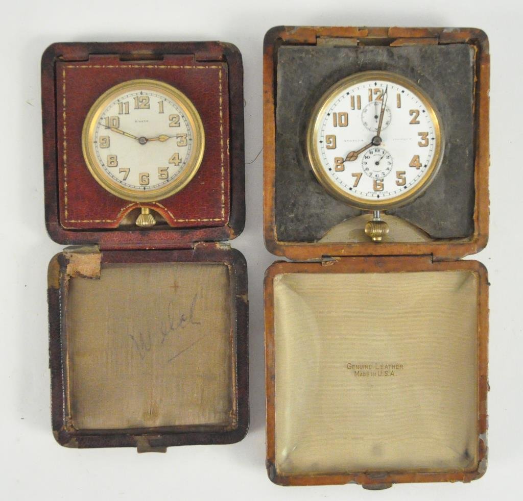 TWO 8 DAY TRAVEL CLOCKS ANGELUS & SWISS: Angelus 8 day and swiss made in original cases. Dimensions: 3.5" square & 4" squareCondition: As is