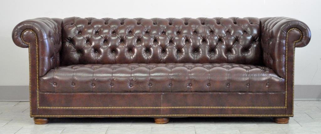 BROWN TUFTED & STUDDED CHESTERFIELD SOFA: Naugahyde. Dimensions: H 30" x W 84" x D 34"Condition: Very good.