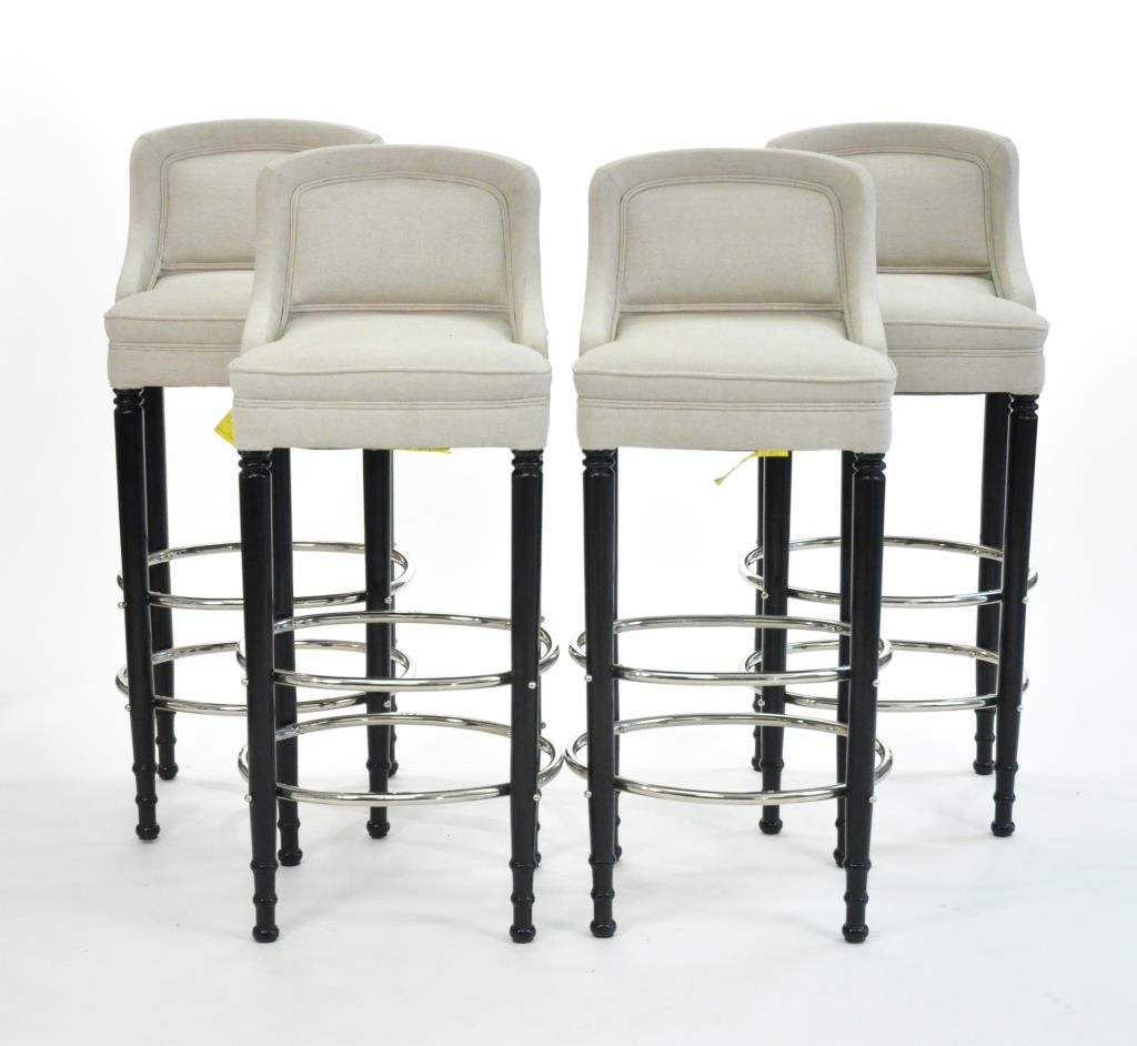 SET OF 4 FRENCH EBONIZED BAR STOOLS: With oval nickeled brass footrests and upholstered seats, circa 1940. Dimensions: H 44" x W 15" x D 17" Condition: very good