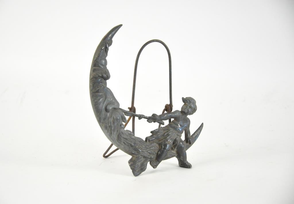 WHIMSICAL BOY WITH MOON MIRROR STAND: Metal. Dimensions: H 9.5" x W 9" x D 1" Condition: Good, missing mirror.