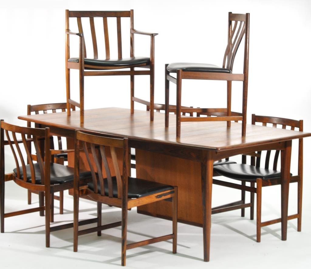 SKOVBY (ATTR.) DANISH ROSEWOOD DINING SUITE: Circa 1960s, Denmark, Fine Dining Table and Chairs, rosewood and leatherMany attractive designed details. Internal inserts to table. Dimensions: H 30" x W 79" x D 41"Condition: Very good original cond