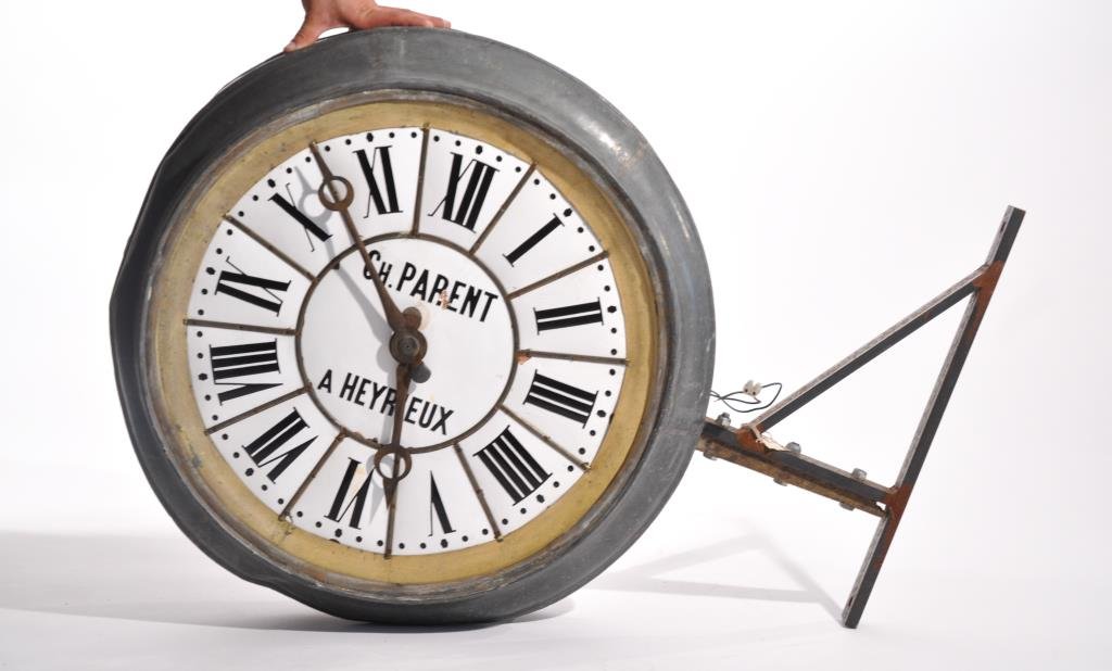 LARGE FRENCH ENAMEL FACE BUILDING TRADE CLOCK: Dimensions: H 30" x W 38"Condition: Has wall mount built into clock, has some missing enamel from face, missing a hand on the clock. Frame is dented.