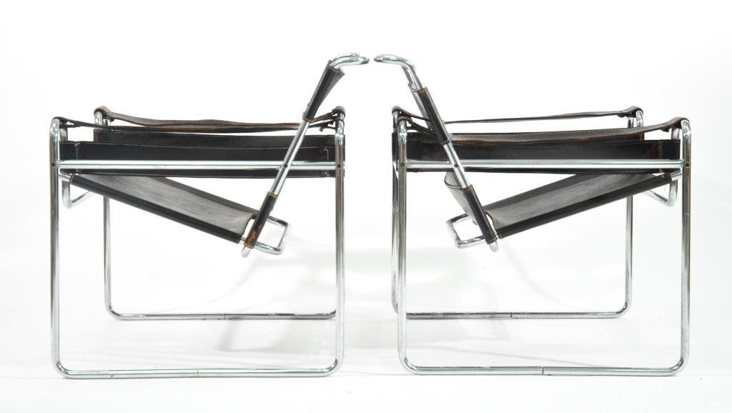 PAIR OF MARCEL BREUER WASSILY CHAIRS: Dimensions: H 29.5" x W 31" x D 29"Condition: Hardening and tearing to leather, needs restoration