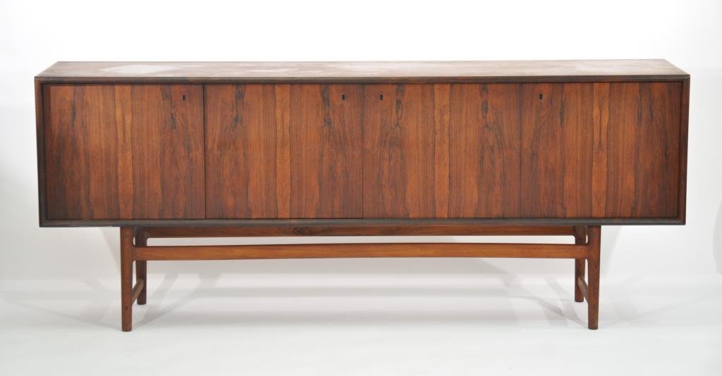 TORBJORN AFDAL (ATTR.) ROSEWOOD CABINET: Circa 1960s, for the Lunning Collection- Georg Jensen, rosewood and painted brass Dimensions: H 34" x W 83" x D 19"Condition: Some dryness to the original finish. Finish back and rosewood interior. Go