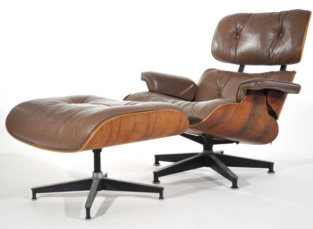 CHARLES & RAY EAMES LOUNGE CHAIR AND OTTOMAN: Lounge Chair and Ottoman, model no. 670 & 671, rosewood, painted steel & aluminum, circa 1970s, manufacturers marksDimensions: H 33" x W 33" x D 33"Condition: Minor scuffs to seat, arm and ottoman cus