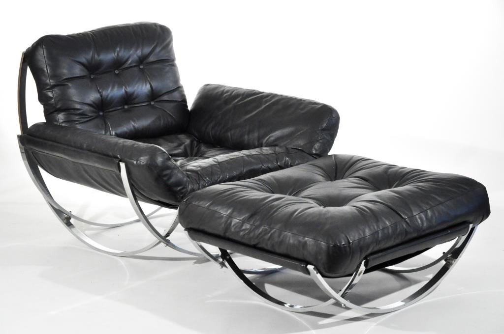 MILO BAUGHMAN (ATTR.) MID-CENTURY ARMCHAIR: Low and wide armchair with ottoman, for Selig, circa 1970sDimensions: Chair: H 33" X W 42" X D 43"Condition: Chrome is mostly clean and bright. Re-covered leather has some scuffs to edges. Very good o