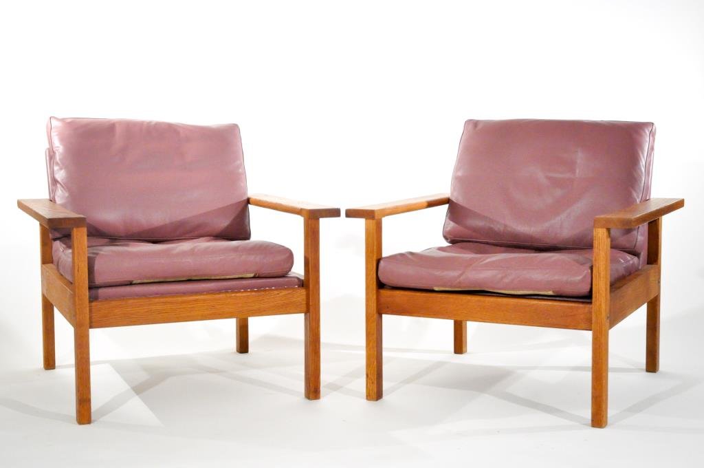 HANS WEGNER (ATTR) PAIR OF CHAIRS: With purple leather removable cushions and oak. Dimensions: H 27" X W 31" X D 30"Condition: Good, small pen marks.