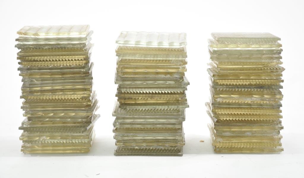 GROUPING OF LUXFER PRISM GLASS TILES: Frank Lloyd Wright designed prisms on top of the base model pattern for this company in 1897.63 tilesDimensions: 4" squareCondition: All with chips and losses