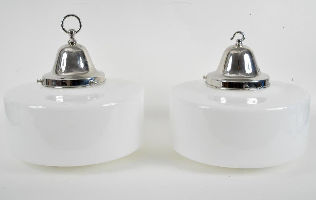 SET OF 2 ENGLISH ART DECO HANGING LIGHTS: White glass and nickel plated, with clear glass Holophane bottoms; slight difference at hangerDimensions: H 14" x D 14"Condition: Good, needs wiring and sockets